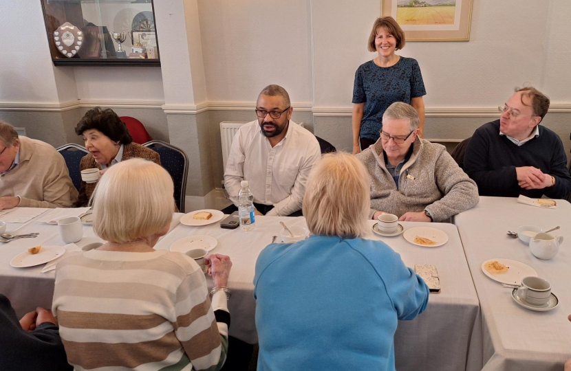 EriKa serves tea to the Home Secretary