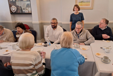 EriKa serves tea to the Home Secretary